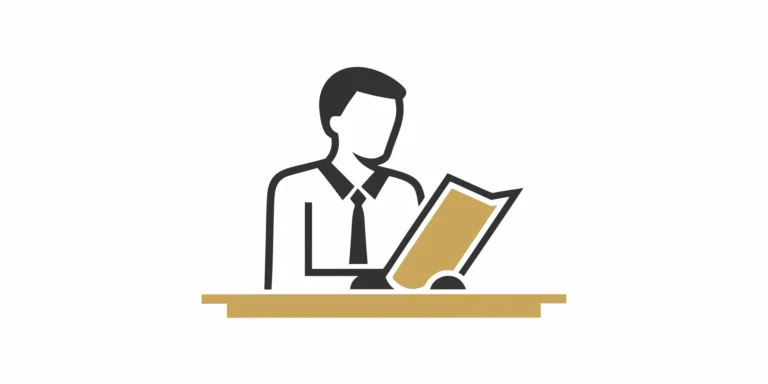 One of the best motorcycle accident attorneys reviewing a client's case file at his desk.