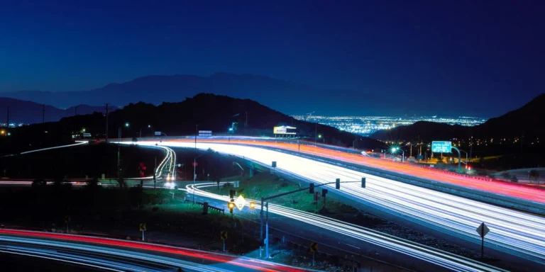 Highway traffic at night in Riverside California near SR-60 and I-15 interchange