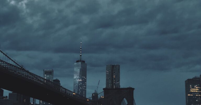 Urban road with cars driving at dusk