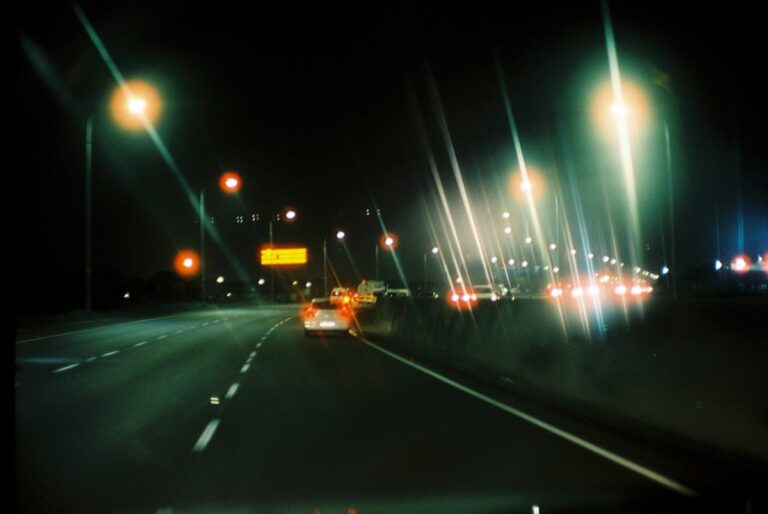 Blurred car lights on a highway at night, depicting traffic conditions relevant to Riverside collision cases