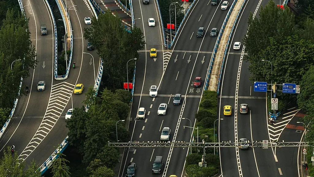 Aerial view of a busy urban highway interchange for San Jose car accident lawyer claims
